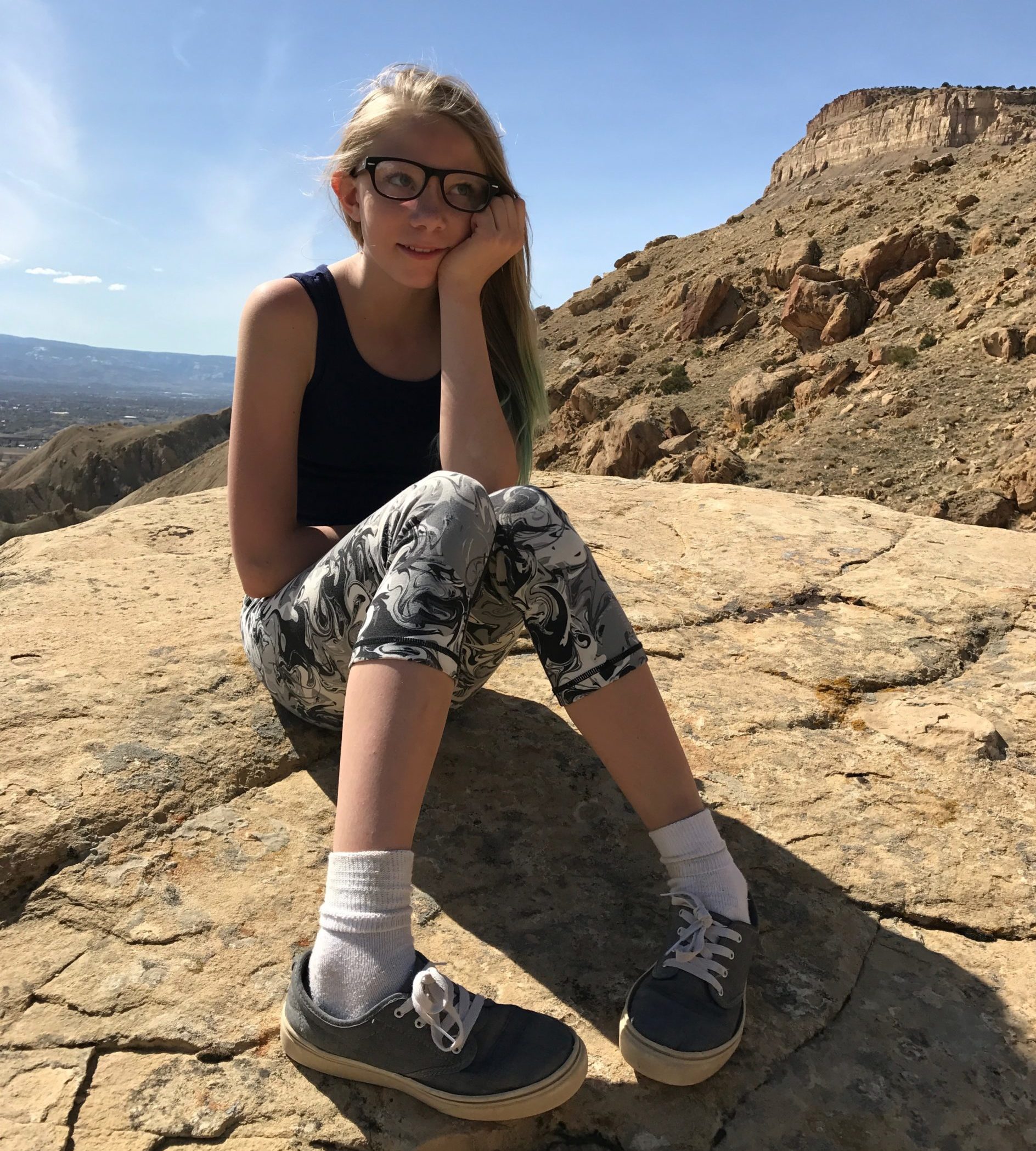 Student_sitting_on_rock